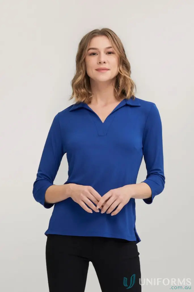 Woman in blue Ella 3qrt Sleeve Polo Top made from polyester matte jersey from City Collection Ella