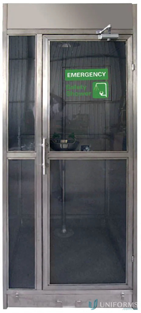 Emergency shower door on stainless steel decontamination booth with eye face wash station