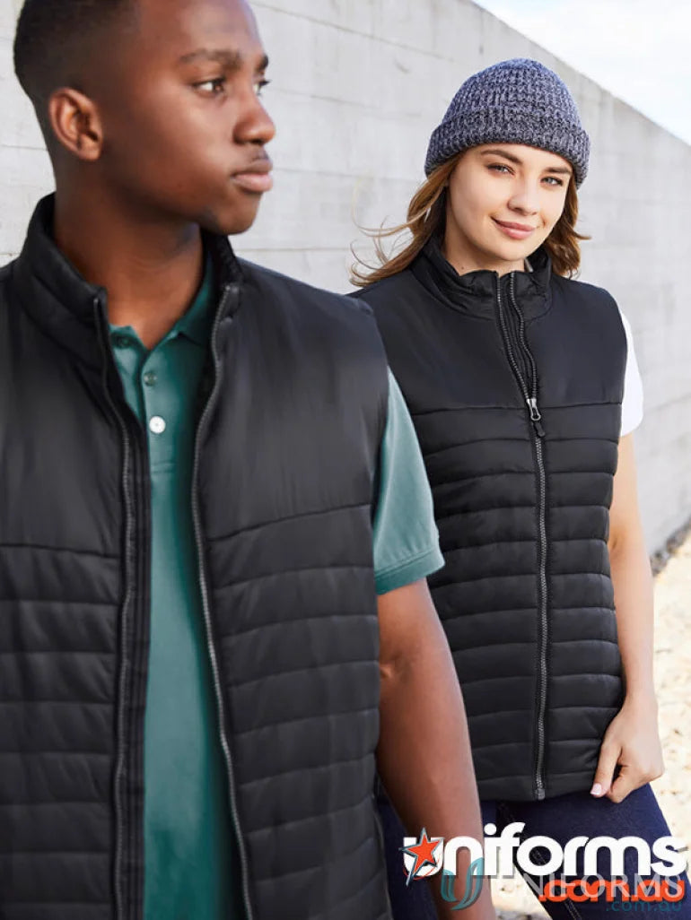 Two women wearing black puffer vests from Biz Collection Women’s Expedition Vest line