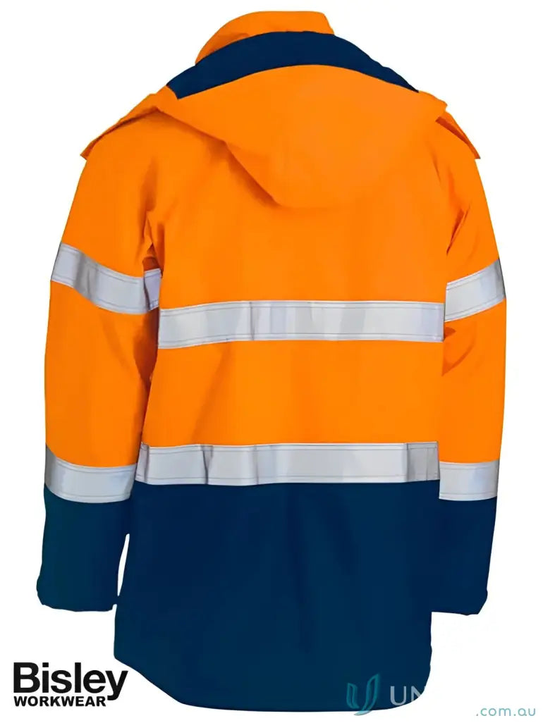Orange and navy blue flame resistant workwear jacket with touch tape closure for hazardous environments