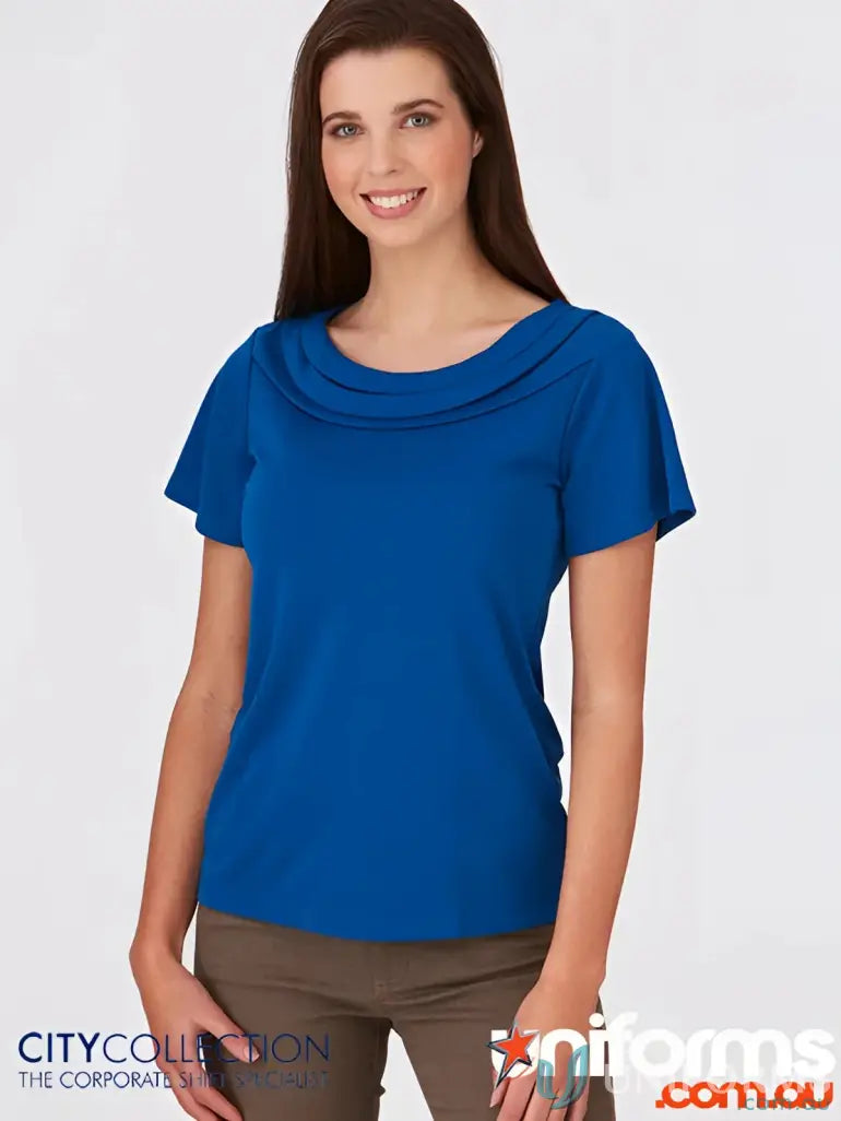 Eva Knit style woman modeling blue short-sleeved knit top with draped neckline