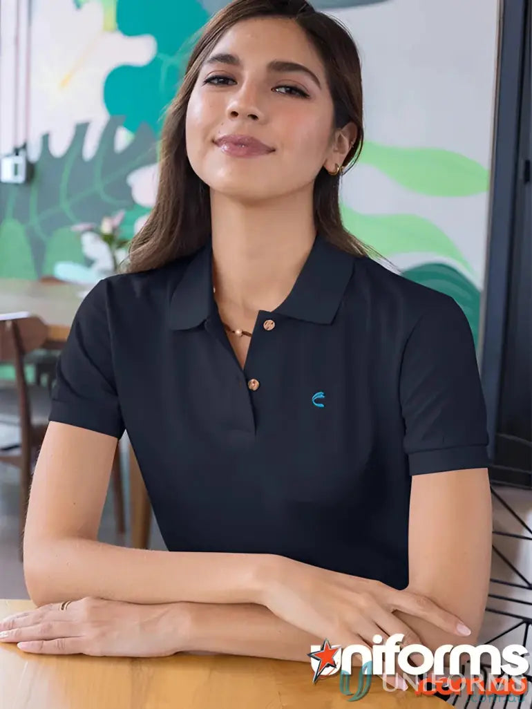 Dark-colored FMIG EMB Ladies Polo with white button placket and light blue logo