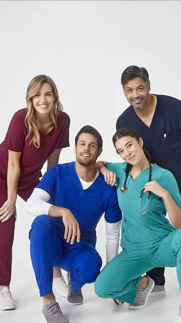 Four medical professionals in scrubs.