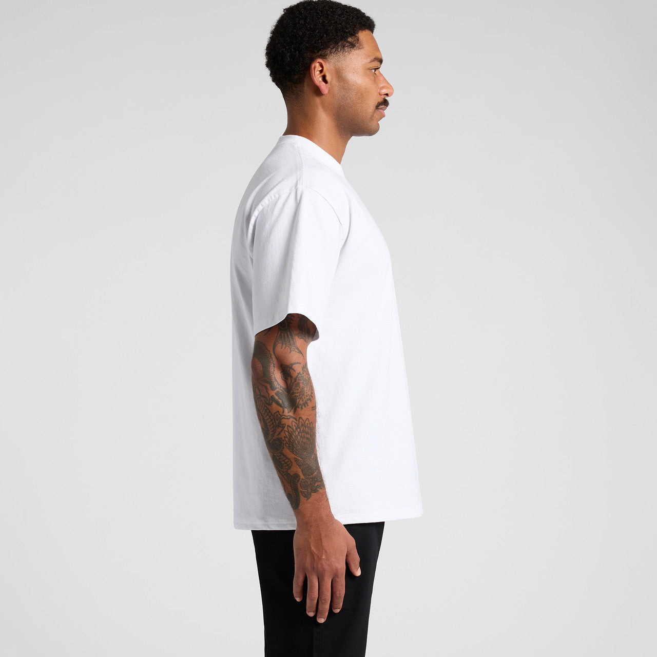 White crew neck t-shirt with short sleeves and a relaxed fit.