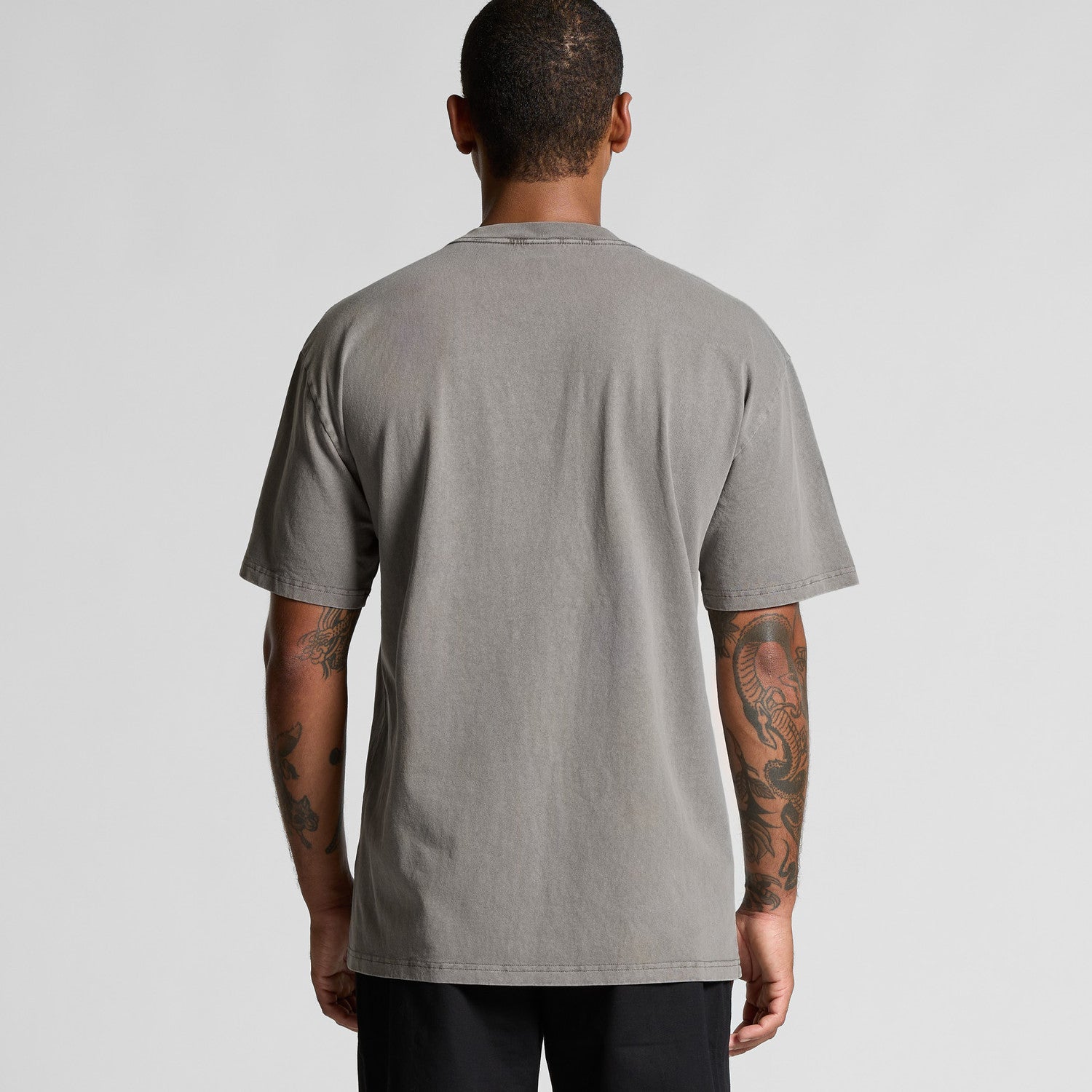 Gray t-shirt with a pocket and ribbed neckline, likely made of cotton or polyester blend.
