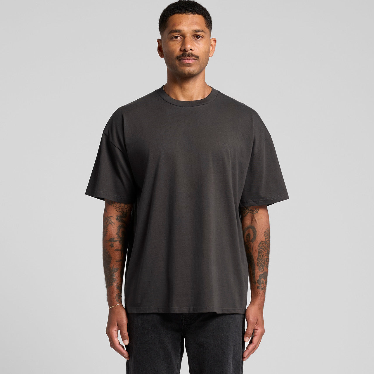Charcoal gray oversized t-shirt with a relaxed fit and crew neck design.