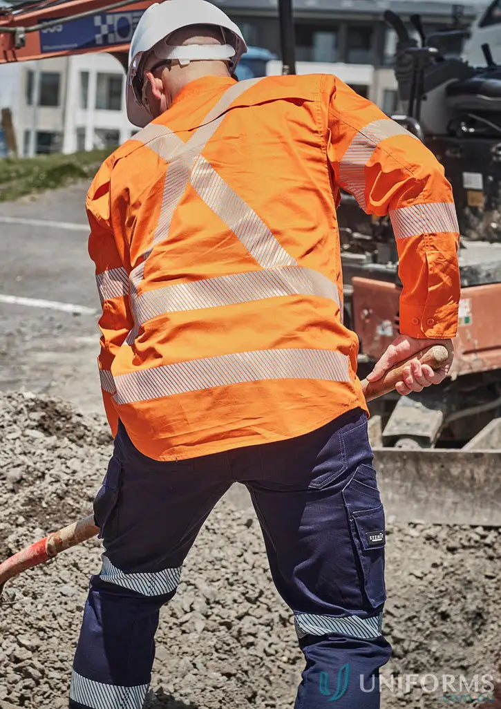 Construction worker in safety gear wearing Hi Vis X Back Shirt with segmented tape and reflective tape