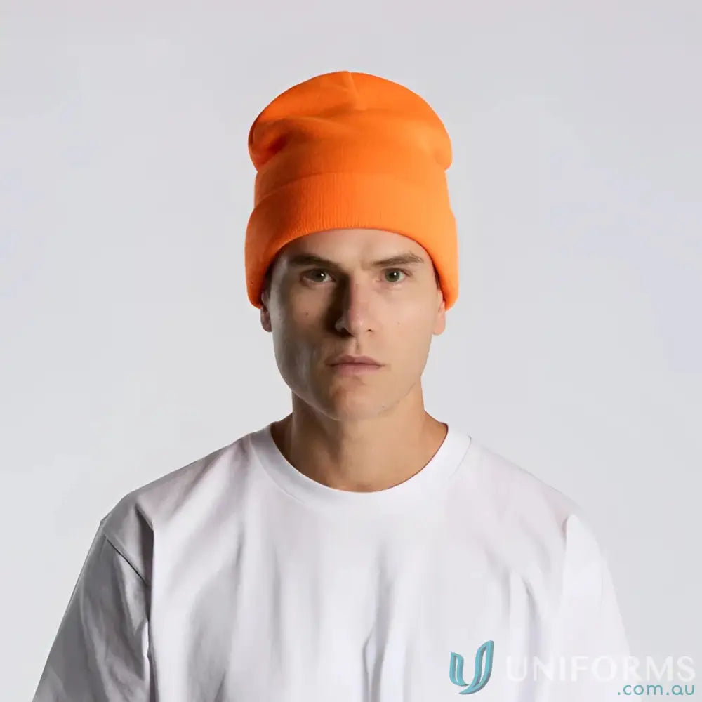 Man wearing high visibility bright orange cuffed beanie with relaxed fit and tight knit