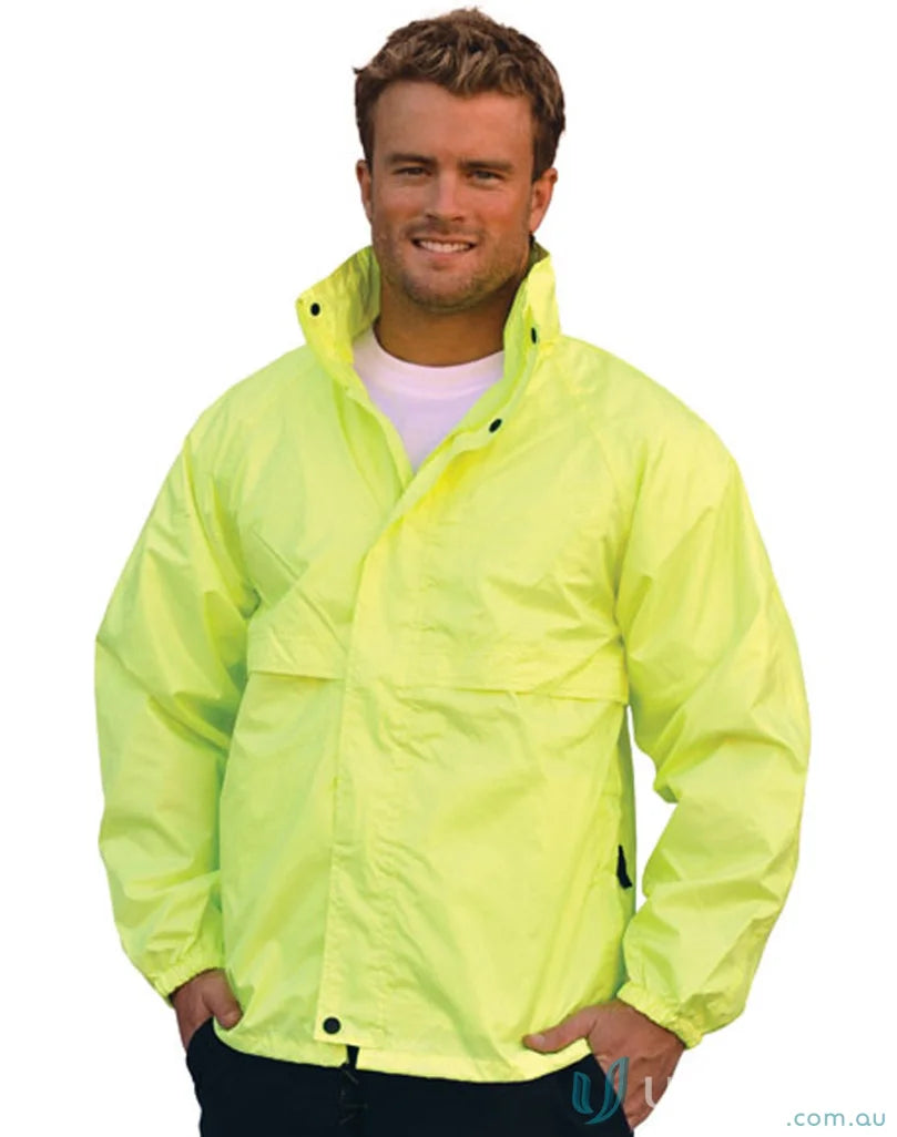 Man in a bright yellow HiVis Spray Jacket staying dry with Spirit SW27 rain gear