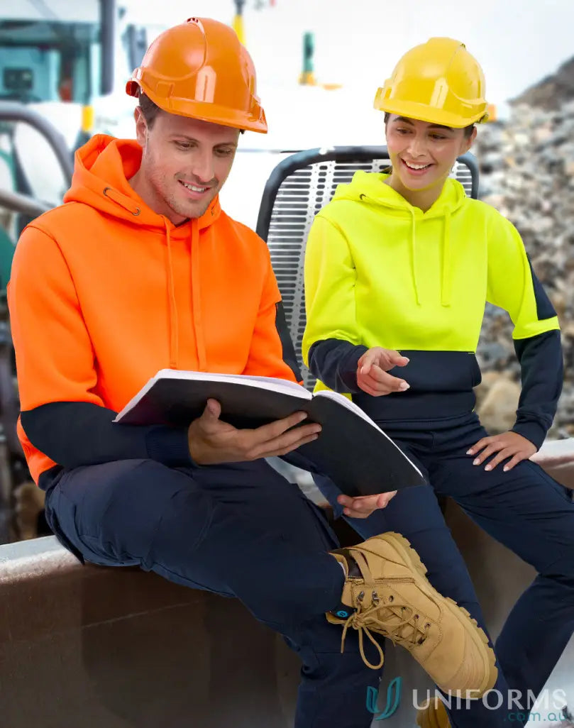 Two workers in HiVis Water Resistant Fleece Hoodie SW91 checking notes outdoors