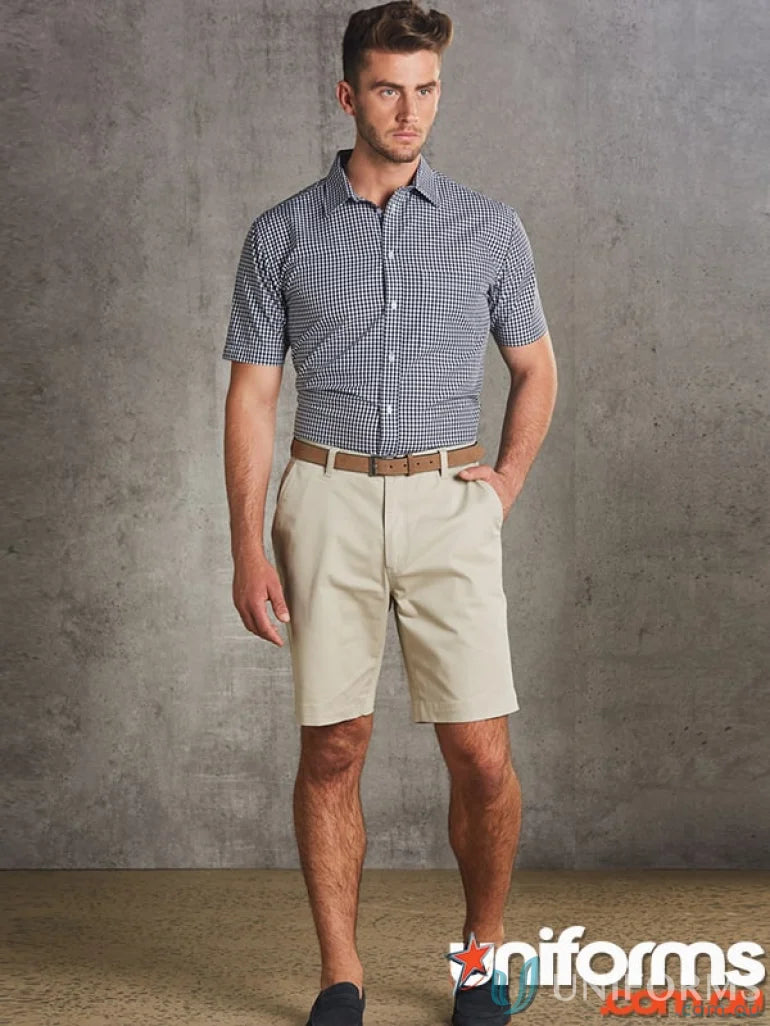 Man in checkered shirt and khaki shorts wearing Housekeep Mens Chino Shorts