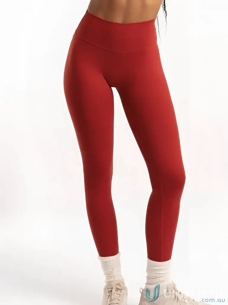 Red athletic leggings with invisible scrunch detail from Invicible Scrunch Cherry Leggings