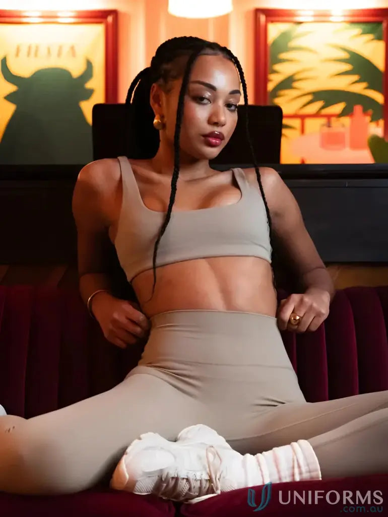 Woman in Invicible Scrunch Latte Leggings wearing stylish athletic wear perfect for workouts