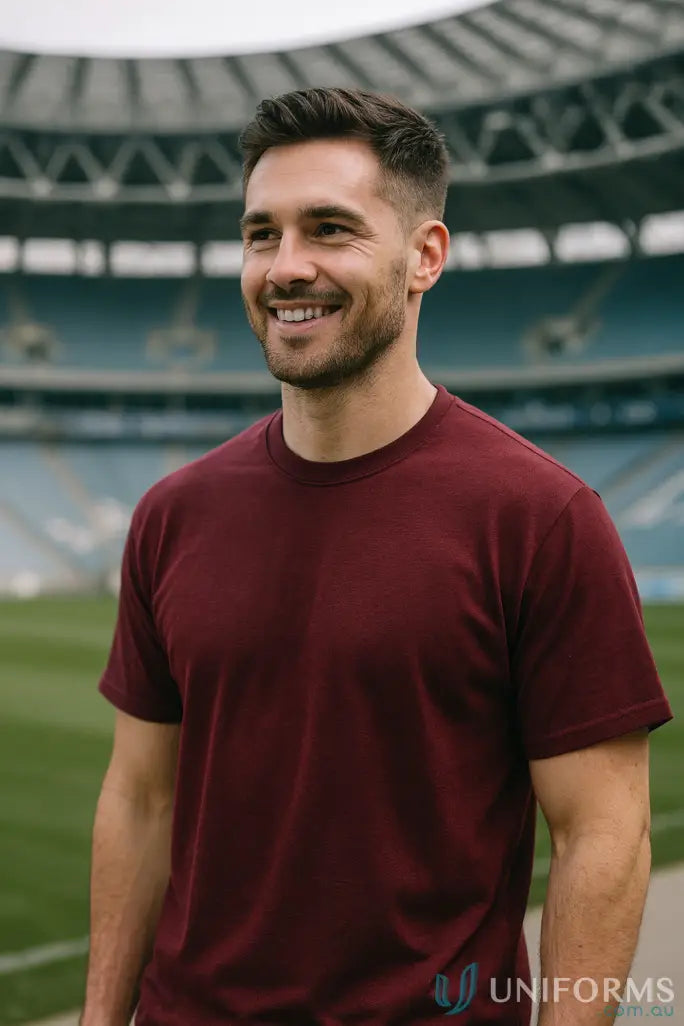 Smiling man in JB’s Adult 1HT Red Tee with classic fit and crew neck style