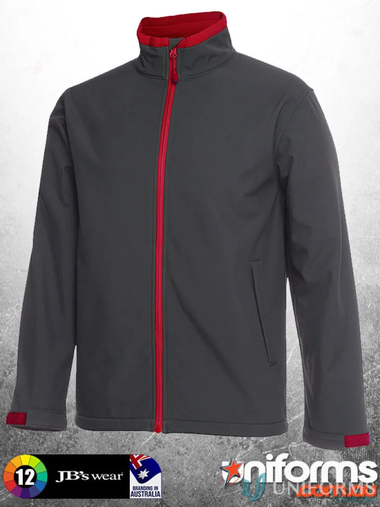 Gray softshell jacket with red trim and zip puller from JBs Adults Stay Dry series