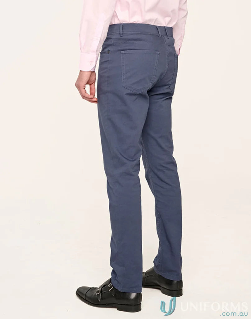 Man wearing jean style flexi chino pants with jacquard weave and black shoes