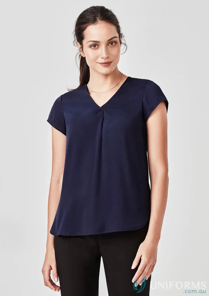 Woman wearing Kayla V-Neck Pleat Blouse in navy from Biz Collection RB967LS