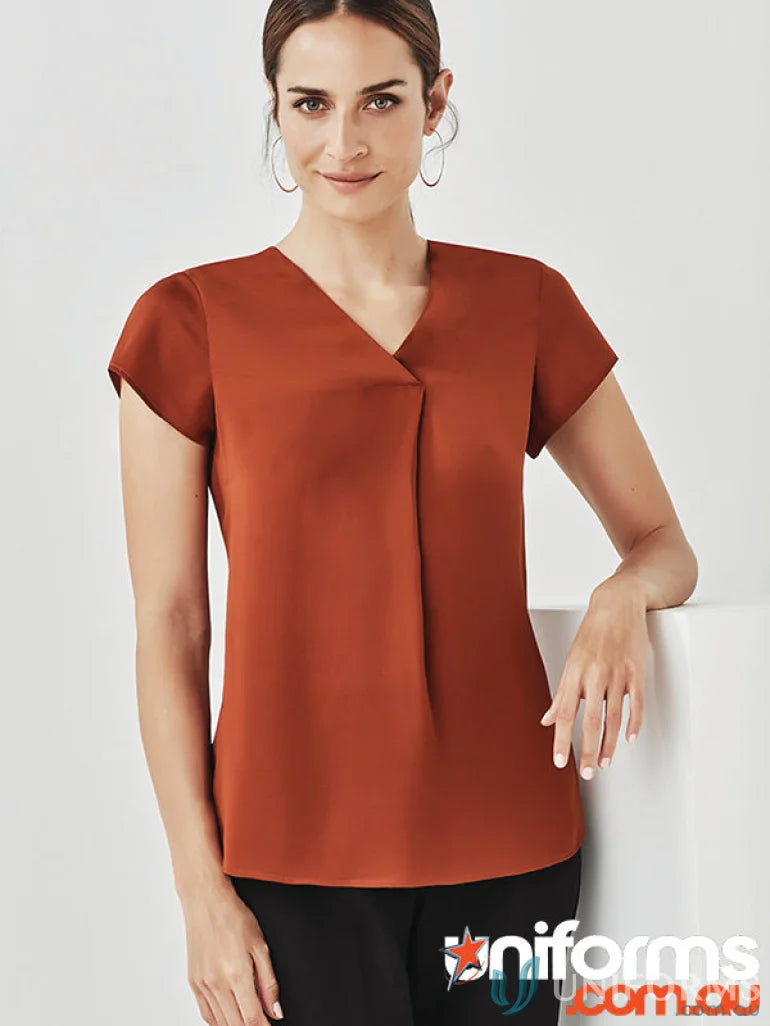 Woman wearing Kayla V-Neck Pleat Blouse in rust color, Biz Collection RB967LS