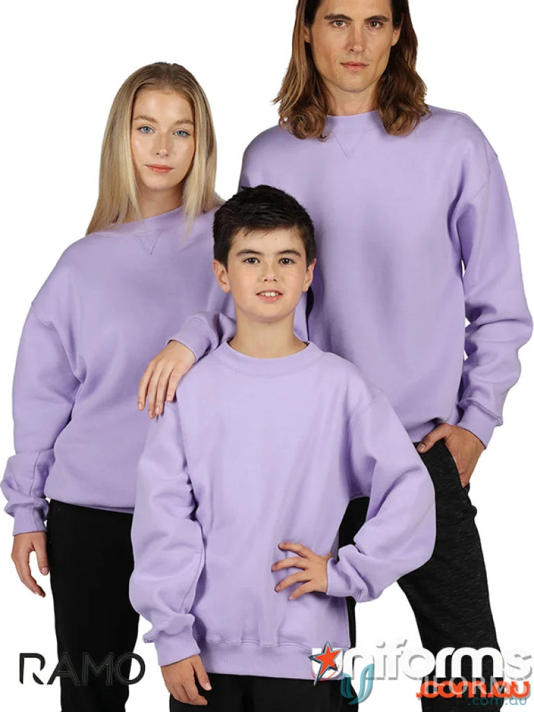 Three people of different ages wearing matching lavender Kids Crew Neck Sloppy Joes
