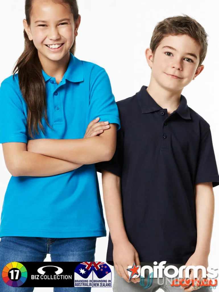 Two kids wearing stylish Kids Crew Polo shirts from Biz Collection Kids school uniform game