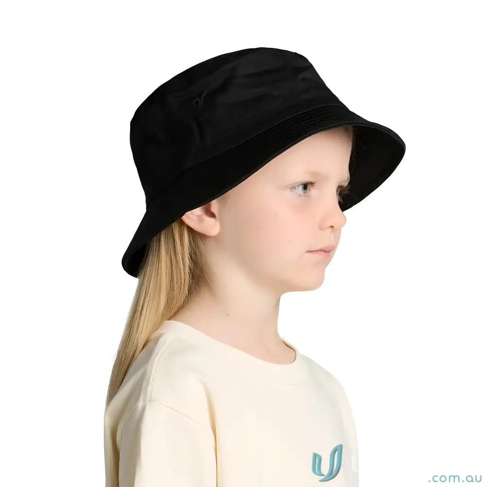 Cute kid wearing a black bucket hat and cream long-sleeved shirt, perfect for uniforms