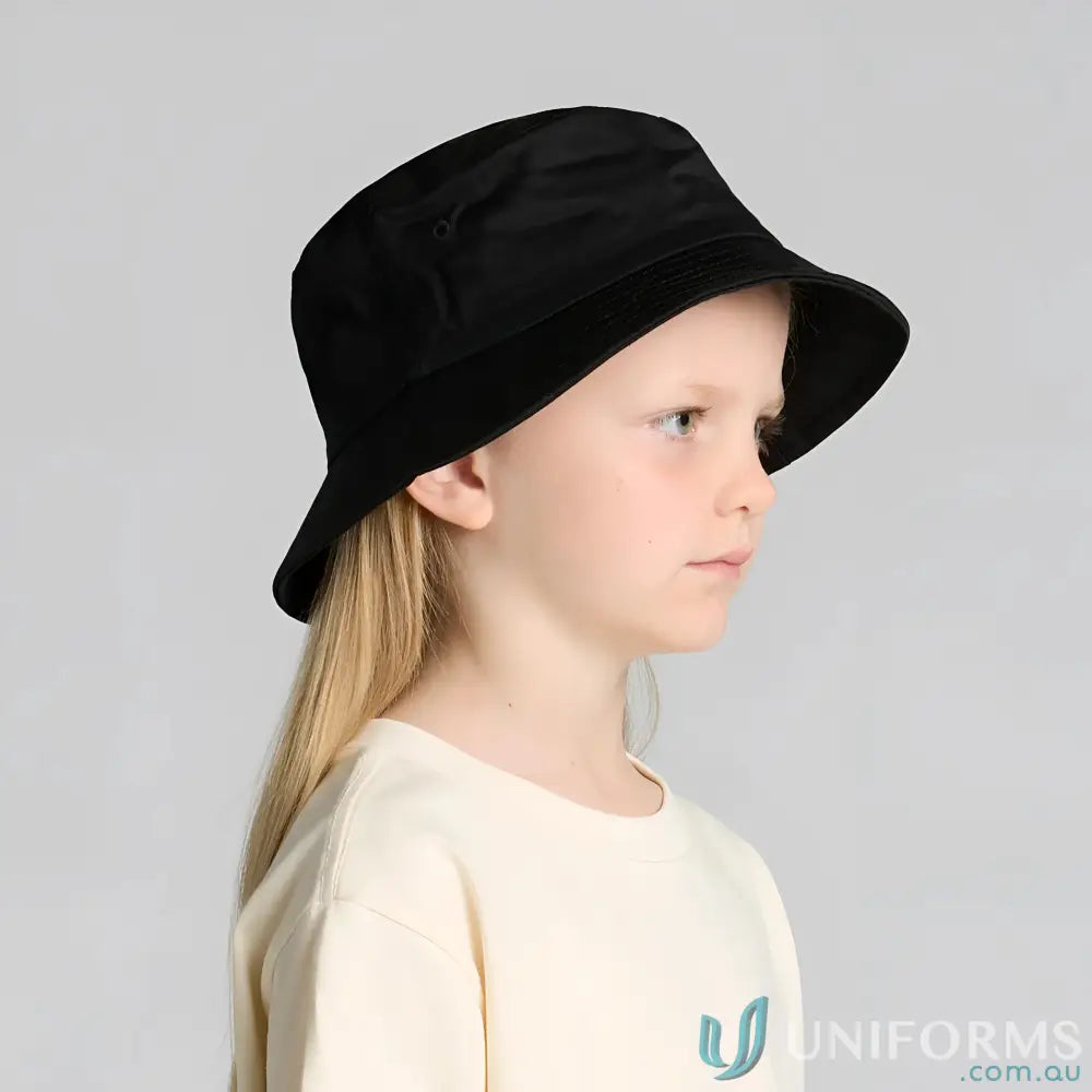 Child wearing a black bucket hat and cream shirt, perfect for kids’ uniforms
