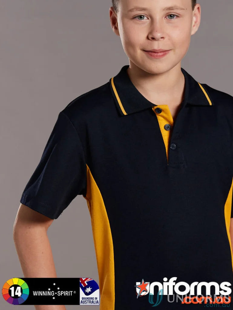 Young boy wearing navy blue and yellow kids team mate polo ps73k teammate polo