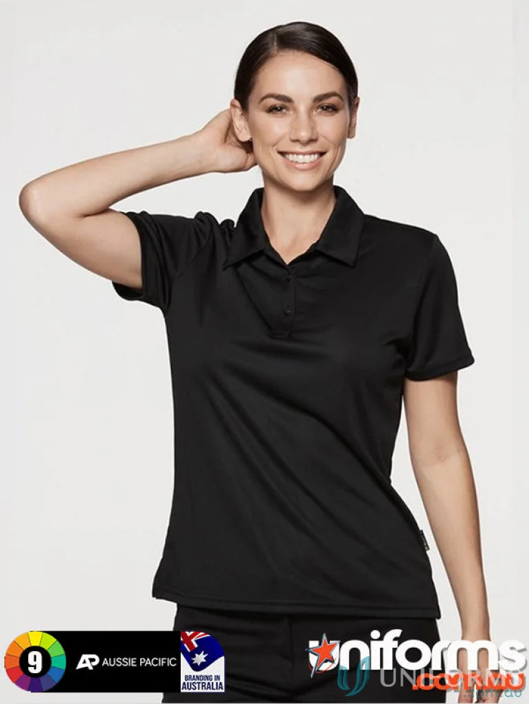 Smiling woman in black fabric Ladies Botany Polo, perfect for uniforms and workwear