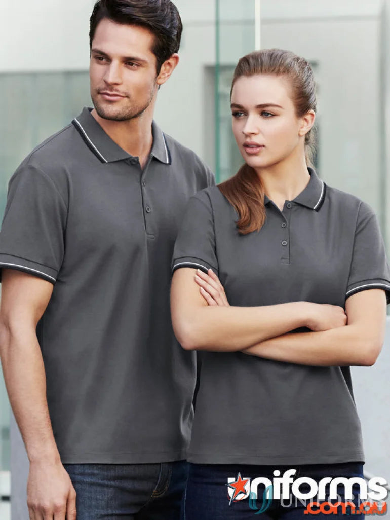 Matching ladies cambridge polo shirts with striped trim worn by a man and woman