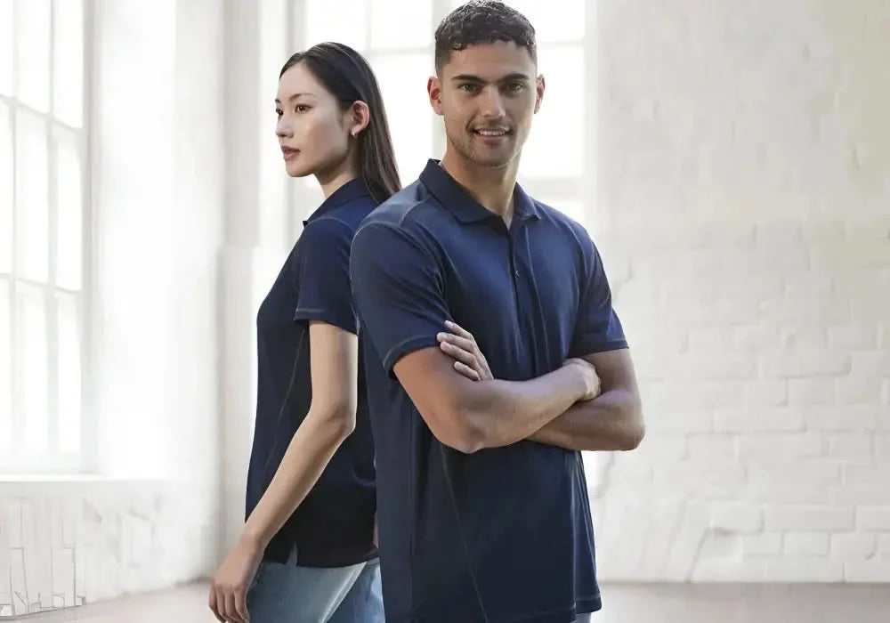 Women wearing matching navy ladies dart polo shirts made of honeycomb knit fabric from Biz Collection Ladies