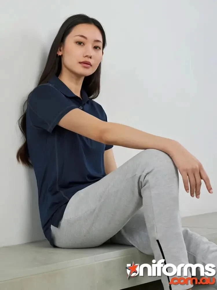 Ladies Dart Polo in navy with honeycomb knit fabric and gray sweatpants, biz collection ladies style