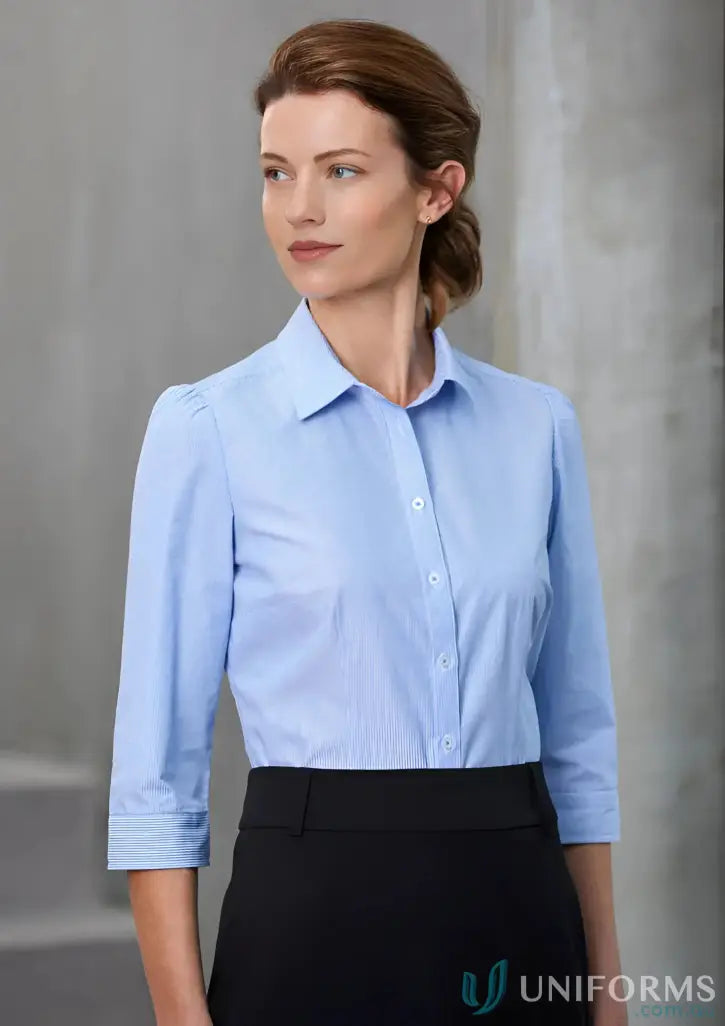 Lady wearing Ladies Euro 3Q Shirt in a biz collection ladies light blue button-down