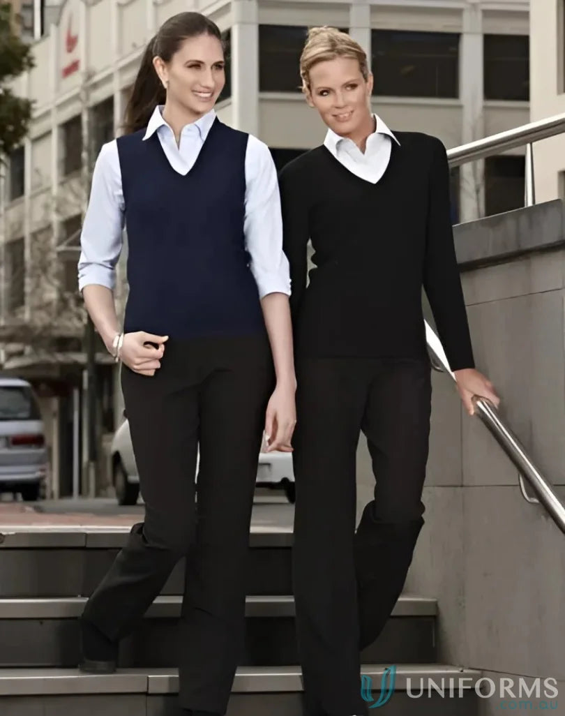 Two women in business attire wearing stylish ladies knit pullovers for a chic look