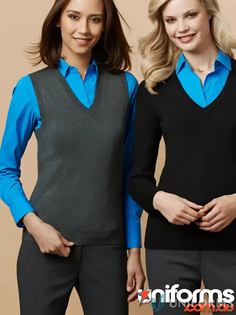 Two women wearing stylish ladies knit vests in business attire for a ladies knit vest shot