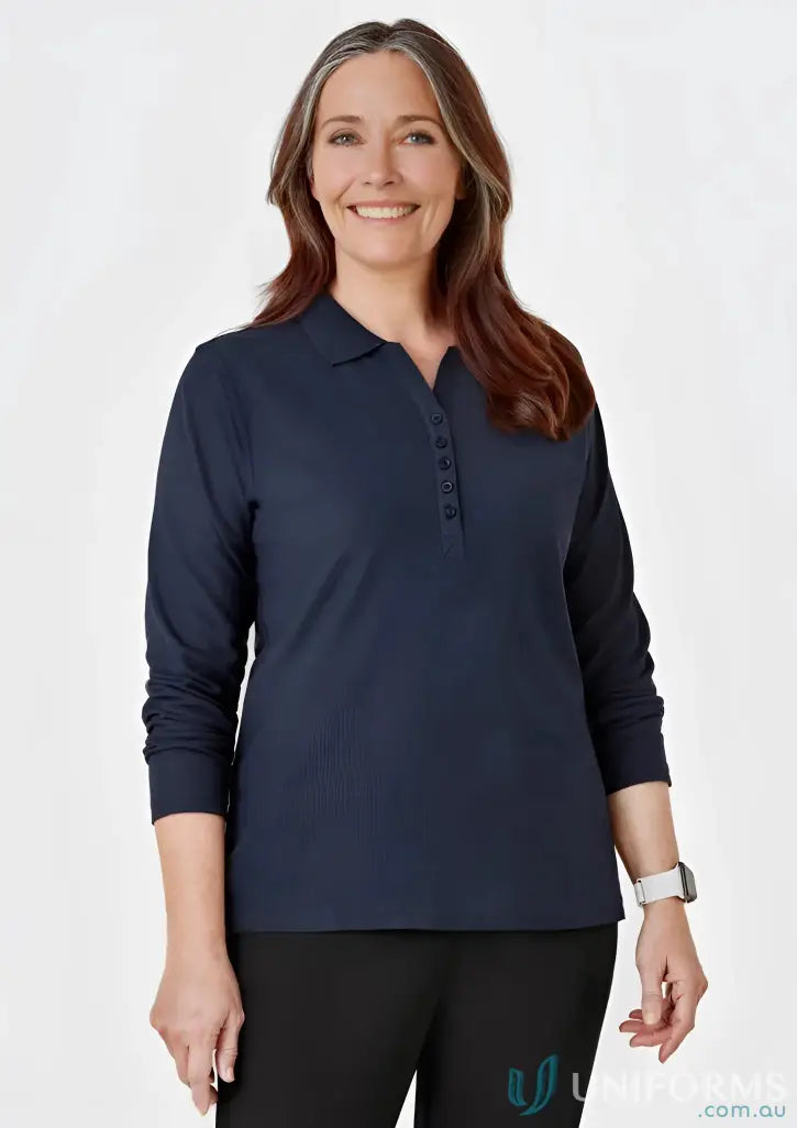 Woman wearing navy long sleeve polo from Biz Collection Ladies p400ll LS Polo