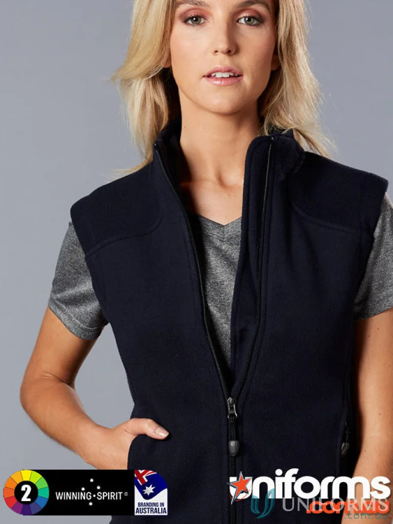 Blonde woman showing Winning Spirit Ladies Micro bonded polar fleece vest with pf10 diamond fleece