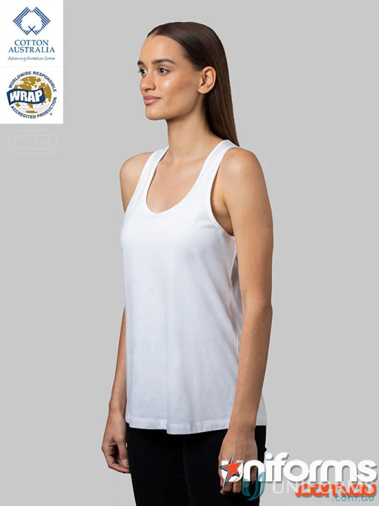 Woman in Ladies Racer Back Singlet measuring perfect length and size in white tank top