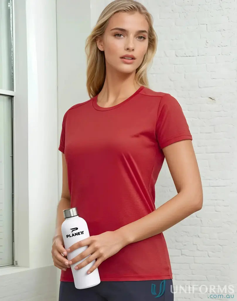 Woman wearing a brick-red Ladies RapidCool Ultra Light Tee for active comfort