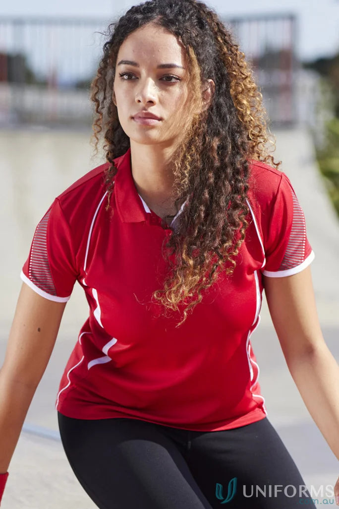 Lady in Biz Collection Ladies Razor Polo with curly hair and black leggings