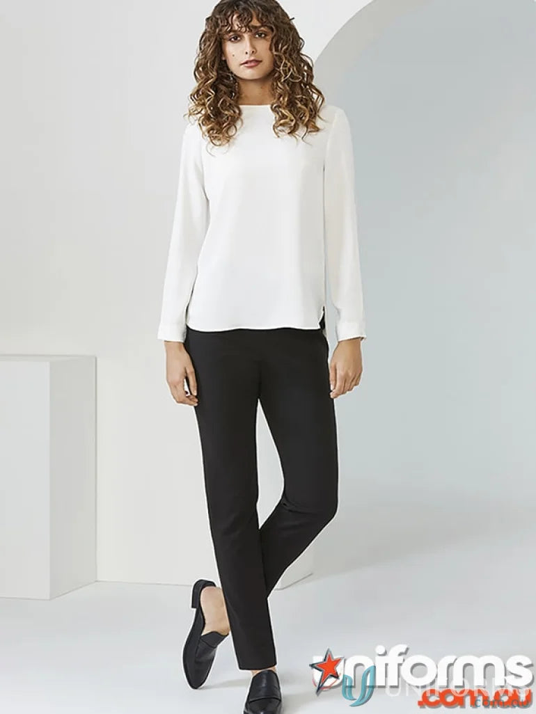 Lady wearing white blouse and black pants from Biz Collection Ladies Remy Pant collection