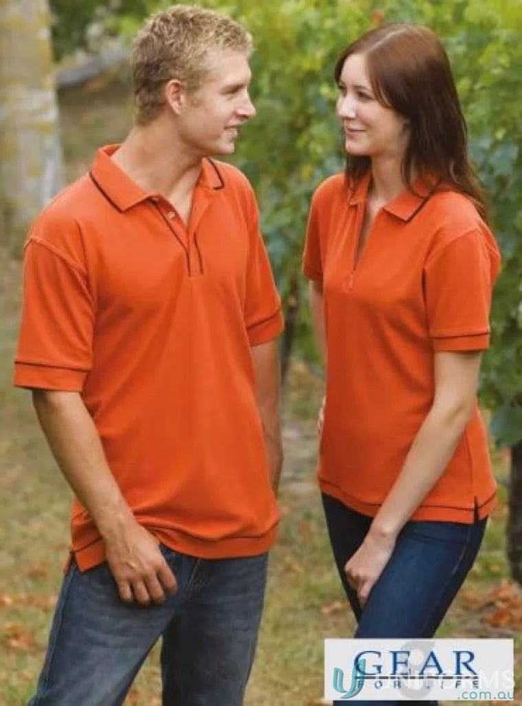 Matching orange polo shirts from Ladies Retro Waffle Polo with navy, black, and white options