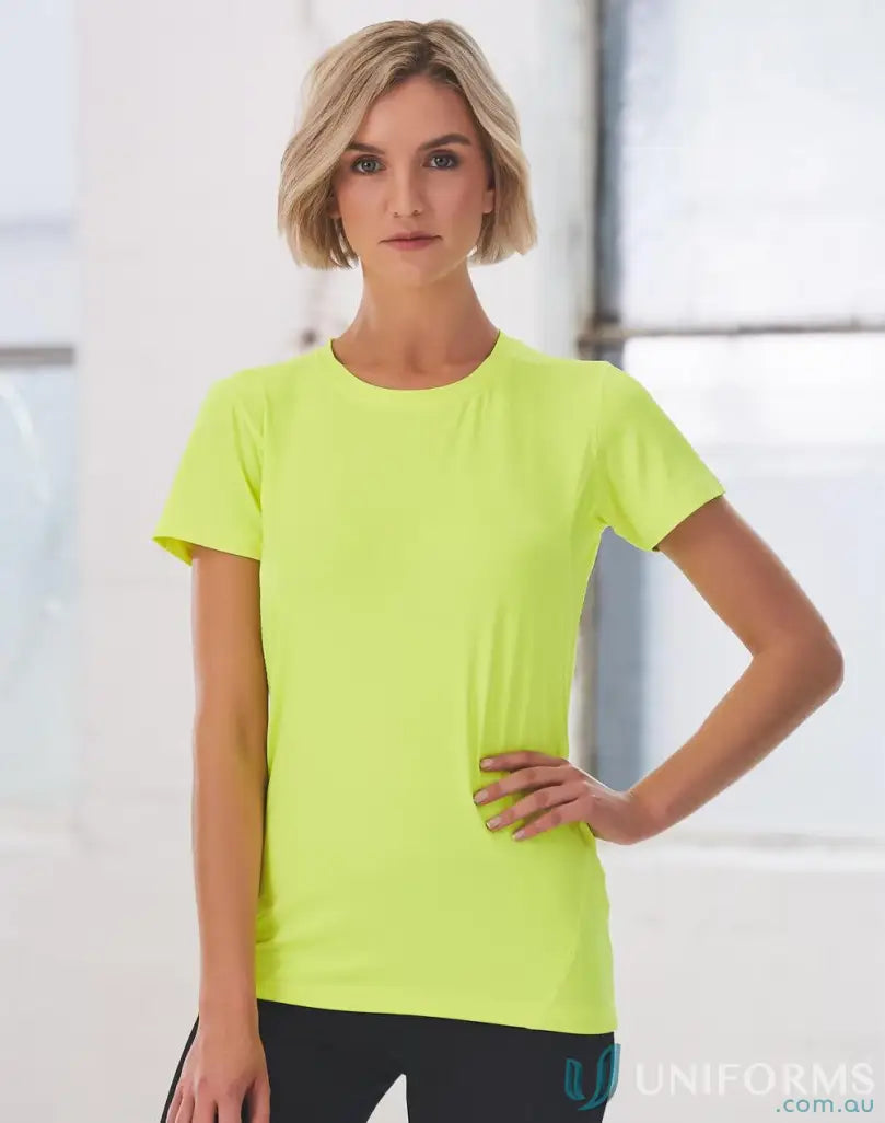 Woman wearing bright yellow Ladies Rotator Sports Tee with cooldry® functions and breathable mesh