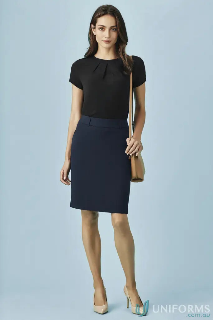 Woman in black short-sleeved top and dark blue pencil skirt, perfect workwear uniform