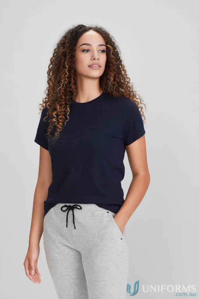 Woman wearing Ladies Southport Tee navy blue ice short sleeve tee and grey sweatpants