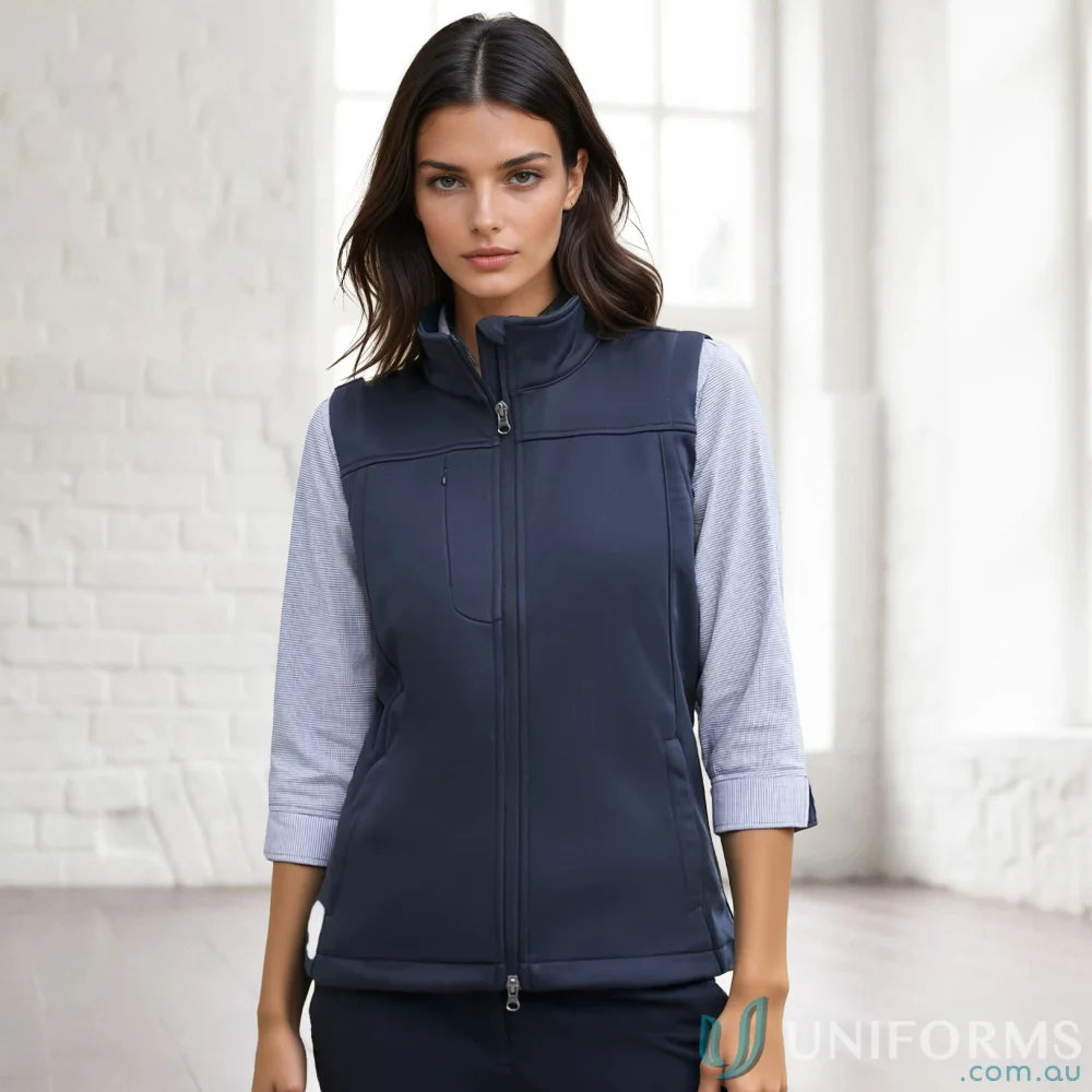 A woman’s navy blue sleeveless vest with a full zipper closure and a stand-up collar.