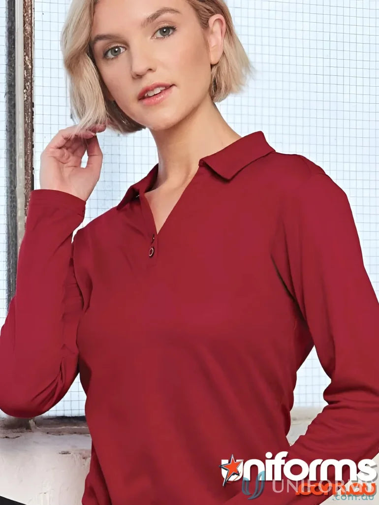 Woman wearing Ladies Victory LS Polo in red with truedry mesh fabric and natural cotton backing