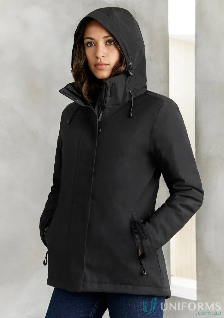 Lady wearing Ladies Waterproof Eclipse Jacket with waterproof zippered pockets and detachable hood