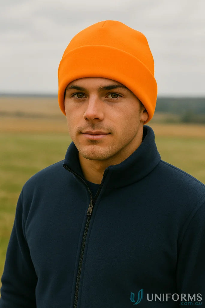 Man in Luminescent Safety Beanie and workwear, perfect for FAQs and uniforms