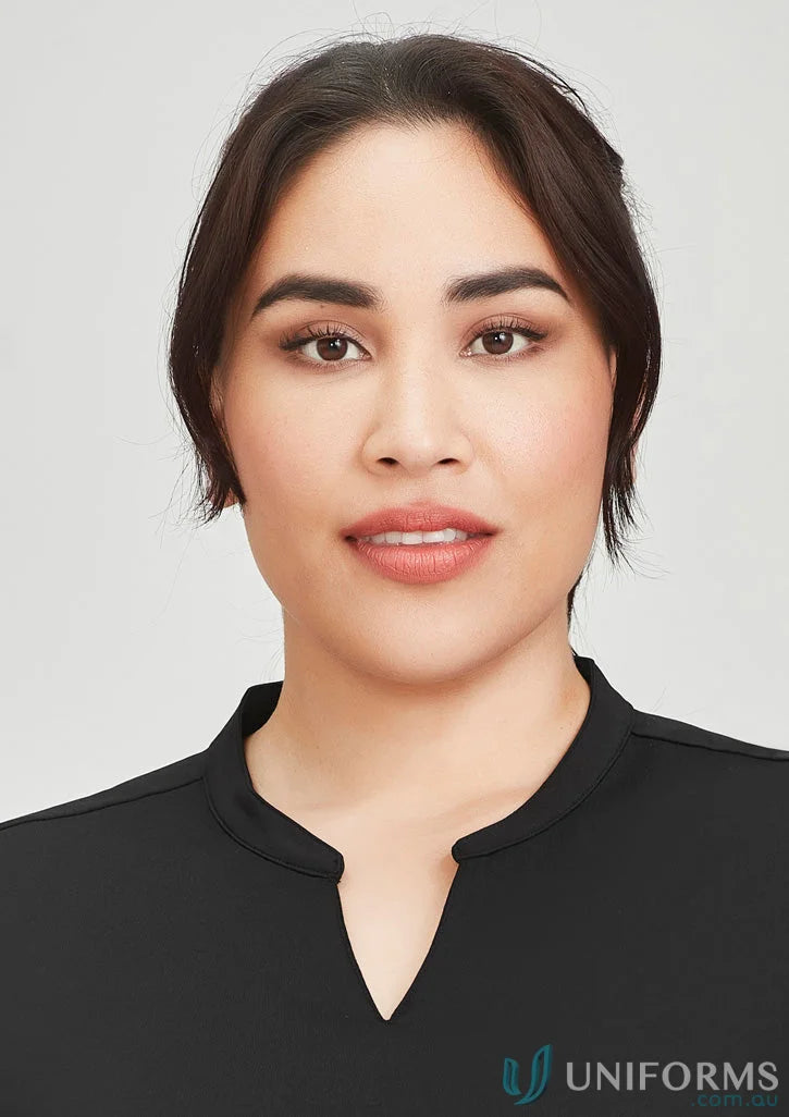 Woman in black top wearing Mali Stretch Tunic jersey t-top for a casual look