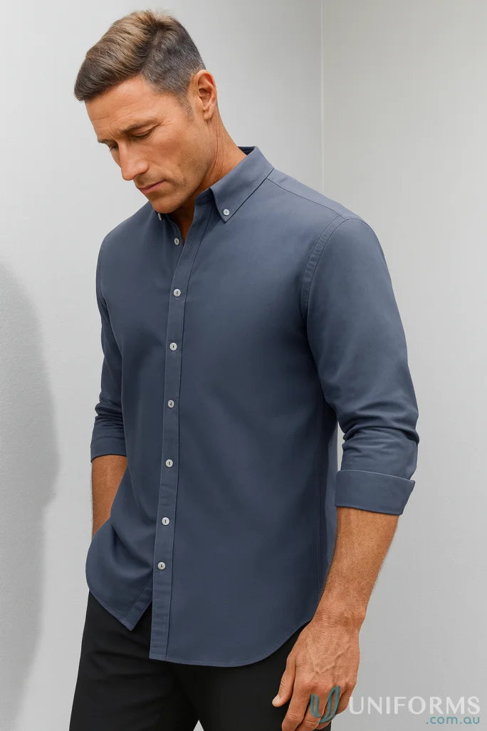 Man wearing Memphis LS Shirt in slate blue with modern button-down collar and pre-shrunk oxford weave